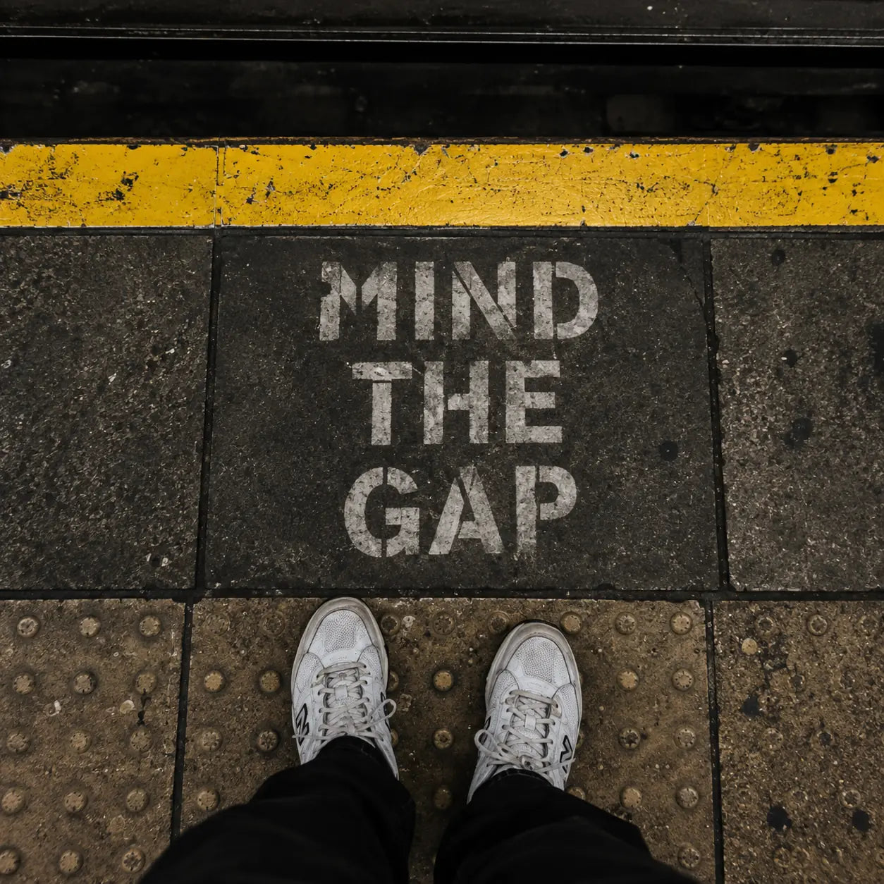 Street-level view of the Mind the Gap marking